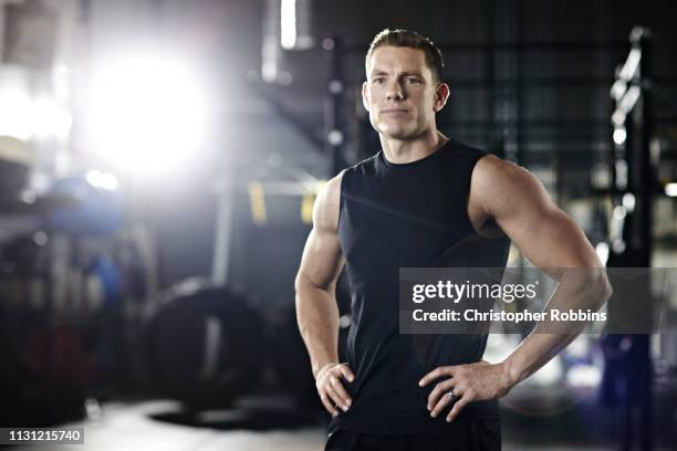 portrait of a trainer in gym - bodybuilder posing stock pictures, royalty-free photos & images