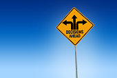 Descisions ahead road sign in warning yellow with blue background, - Illustration