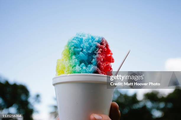 close up of colorful snow cone - wassereis stock-fotos und bilder