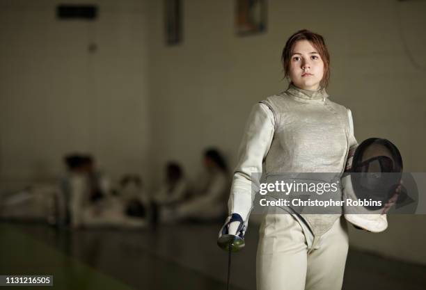 portrait of teenage female fencer - youth fencing sport stock pictures, royalty-free photos & images