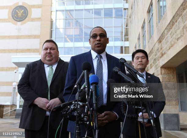 Special Agent Gordon Johnson , speaks while flanked by U.S. Attorney Robert Hur speaks while flanked by , and Art Walker of the Coast Guard...