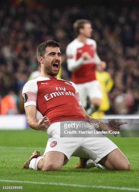 Sokratis of Arsenal celebrates after scoring his team's third goal during the UEFA Europa League Round of 32 Second Leg match between Arsenal and...