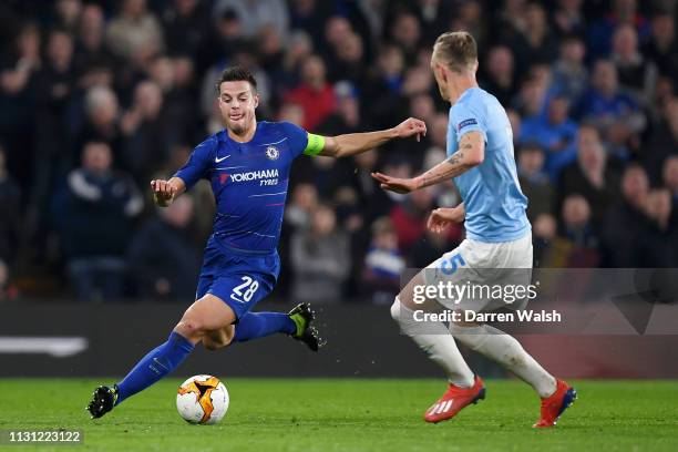 Cesar Azpilicueta of Chelsea is challenged by Soren Rieks of Malmo during the UEFA Europa League Round of 32 Second Leg match between Chelsea and...