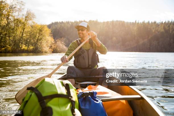 a man on a canoe adventure - bellingham stockfoto's en -beelden