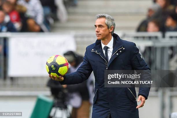 Bordeaux's Portuguese head coach Paulo Sousa holds a ball during the French L1 football match between Girondins de Bordeaux and Rennes on March 17,...