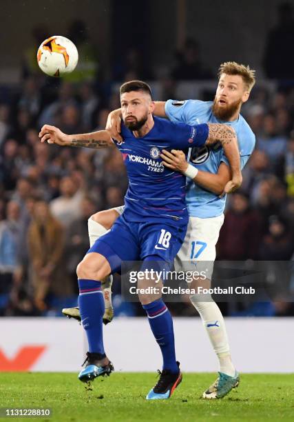 Olivier Giroud of Chelsea is challenged by Rasmus Bengtsson of Malmo during the UEFA Europa League Round of 32 Second Leg match between Chelsea and...