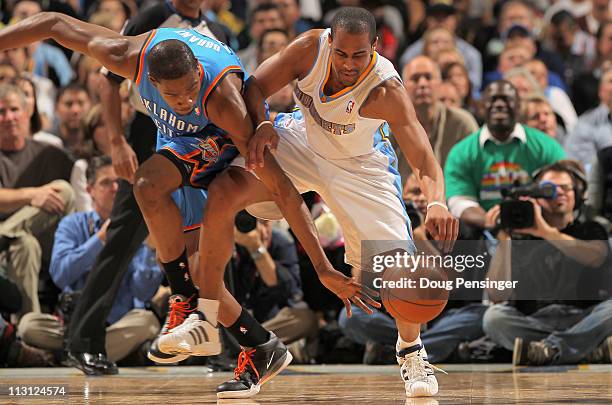 Kevin Durant of the Oklahoma City Thunder and Arron Afflalo of the Denver Nuggets battle for control of the ball in Game Three of the Western...