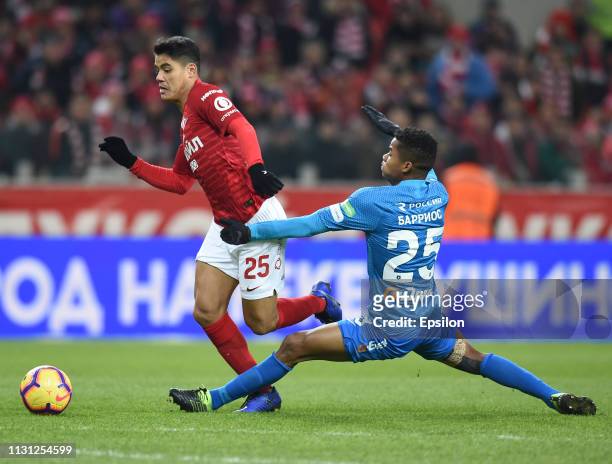 Lorenzo Melgarejo of FC Spartak Moscow vies for the ball with Wilmar Barrios of FC Zenit Saint Petersburg during the Russian Premier League match...