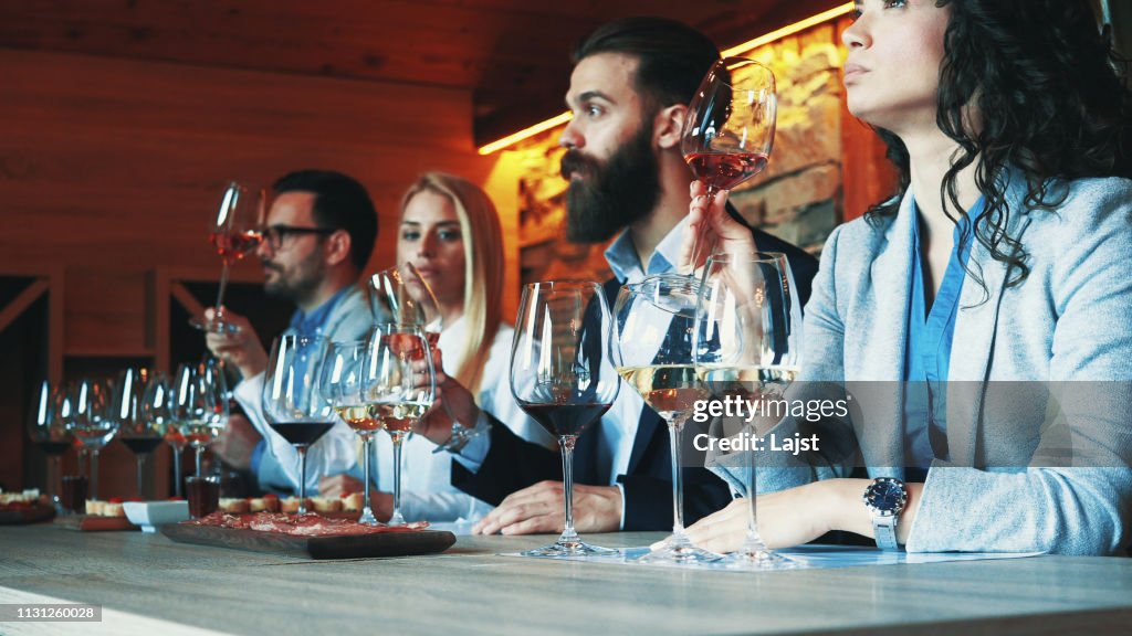 Friends tasting wine together