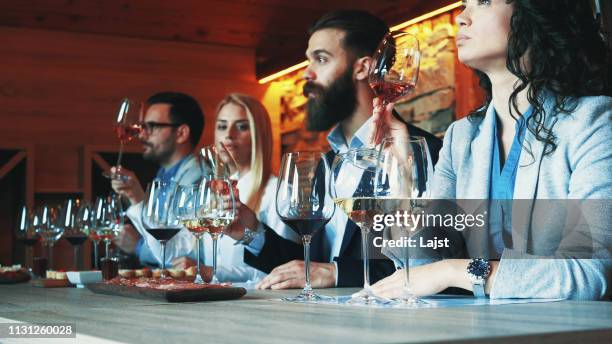 friends tasting wine together - taste test stock pictures, royalty-free photos & images