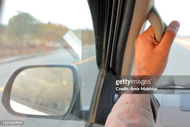holding car arm handle, rear view mirror from inside the vehicle or car - handle stock pictures, royalty-free photos & images