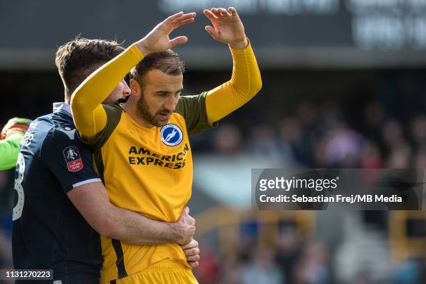 Ryan Leonard of Millwall holds Glenn Murray of Brighton and Hove Albion during the FA Cup Quarter Final match between Millwall and Brighton and Hove...