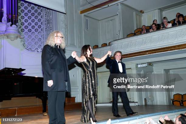 Pianist Yvan Cassar, soprano Aleksandra Kurzak and tenor Roberto Alagna acknowledge the applause of the audience after have performed during attend...