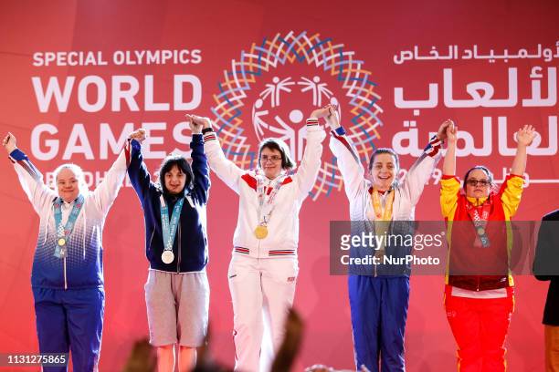 Athletes show their emotions when receiving their medals during declaration ceremony at the Special Olympics World Games in Abu Dhabi National...