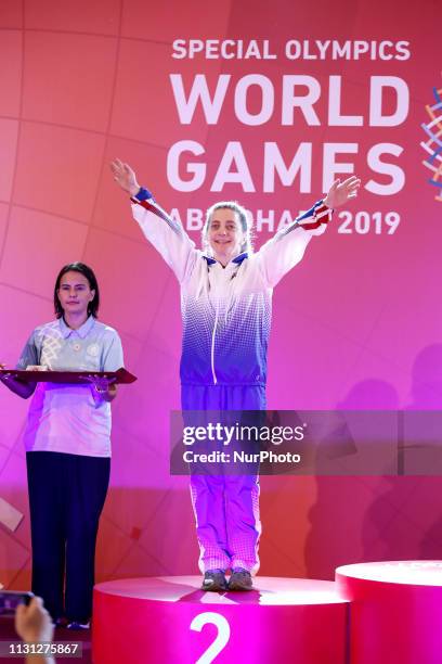 Athlete from USA shows her emotions when receiving their medals during declaration ceremony at the Special Olympics World Games in Abu Dhabi National...