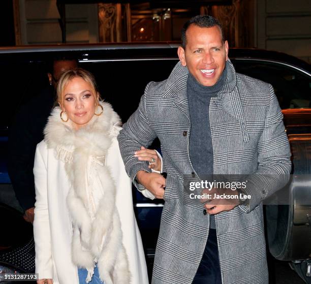 Jennifer Lopez flashes her big engagement ring when out for dinner with Alex Rodriguez on March 17, 2019 in New York City.