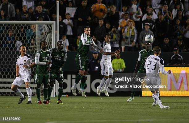 David Beckham of the Los Angeles Galaxy takes a free kick in the first half during the MLS match against the Portland Timbers at The Home Depot...