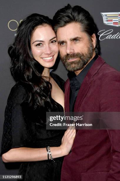 Caitlin McHugh and John Stamos attend the Cadillac celebrates The 91st Annual Academy Awards at Chateau Marmont on February 21, 2019 in Los Angeles,...