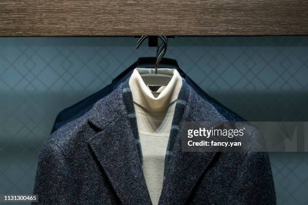 close up of jacket in a window display - menswear stock-fotos und bilder