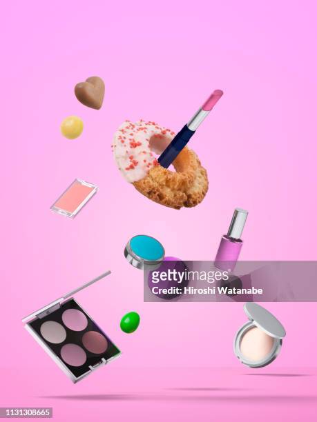 cosmetics and sweets in the air. - mid air object stock pictures, royalty-free photos & images
