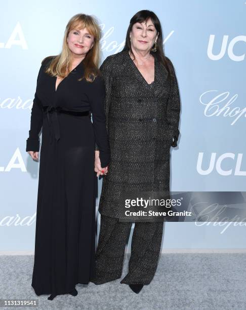 Rebecca De Mornay and Anjelica Huston arrive at the Hollywood For Science Gala at Private Residence on February 21, 2019 in Los Angeles, California.