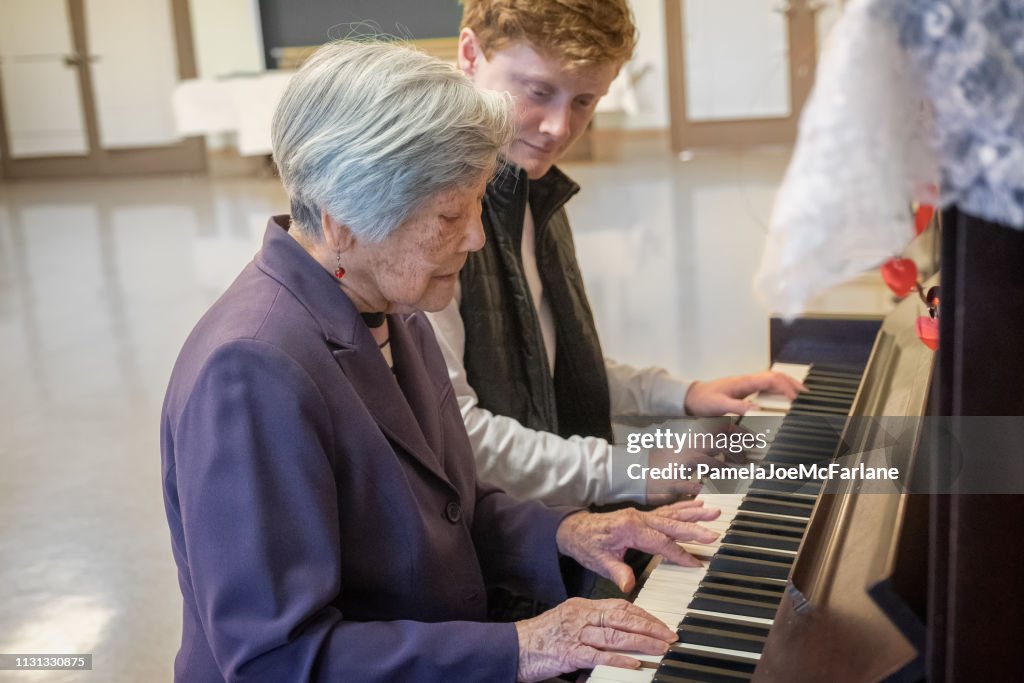 Music Therapy, Senior Asian Woman Playing Piano with Young Man