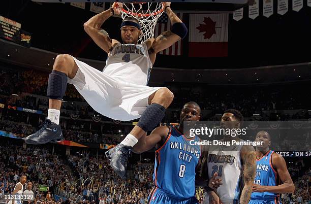 Kenyon Martin of the Denver Nuggets dunks the ball as Nazr Mohammed of the Oklahoma City Thunder, Wilson Chandler of the Denver Nuggets and Kevin...