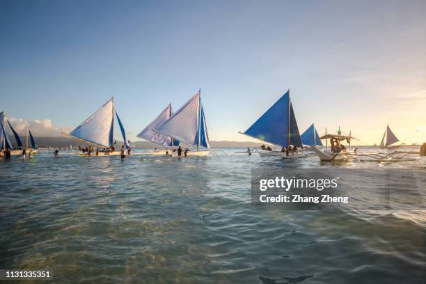 the sailing boat in sunset - boracay beach stock pictures, royalty-free photos & images