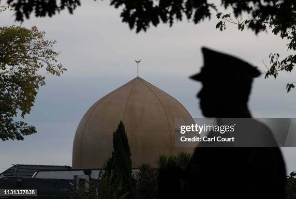 Police officer stands guard near Al Noor mosque on March 18, 2019 in Christchurch, New Zealand. 50 people were killed, and dozens are still injured...