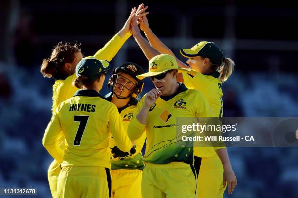 Jess Jonassen of Australia celebrates after taking the wicket of Amy Satterthwaite of New Zealand during Game 1 of the Women's One Day International...