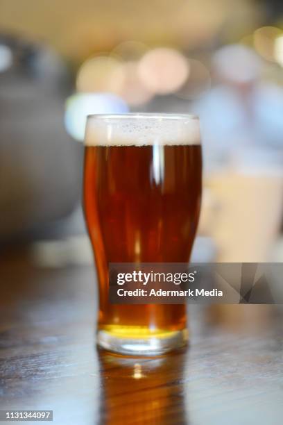 a pint in the pub - pint stock-fotos und bilder