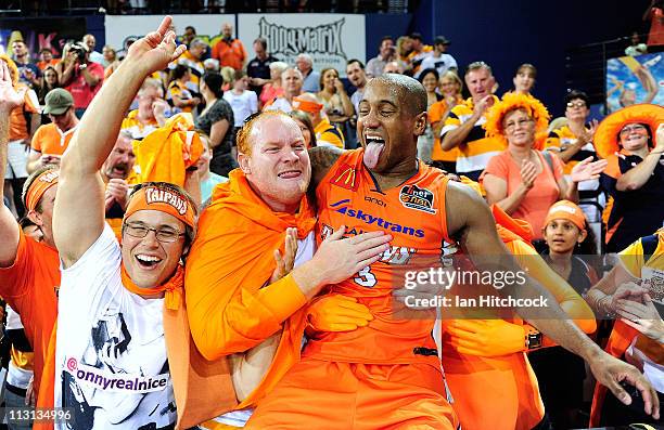 Ayinde Ubaka of the the Taipans celebrates with fans after winning game two of the NBL Grand Final series between the Cairns Taipans and the New...