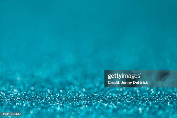 turquoise glitter - teal bokeh stock pictures, royalty-free photos & images