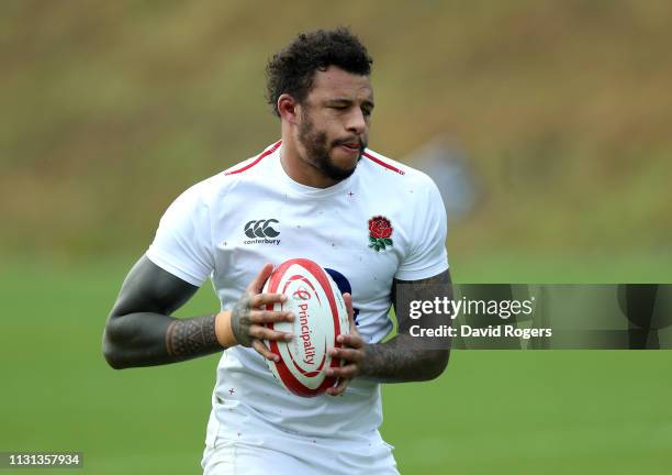 Courtney Lawes runs with the ball during the England captains run held at Pennyhill Park on February 22, 2019 in Bagshot, England.