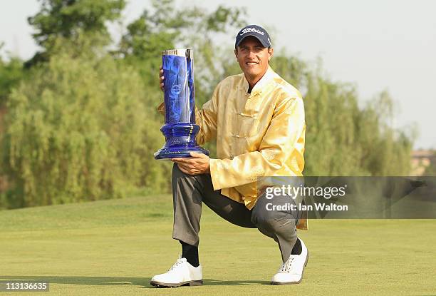 Nicolas Colsaerts of Belgium celebrates with the trophy after winning the Volvo China Open at Luxehills Country Club on April 24, 2011 in Chengdu,...