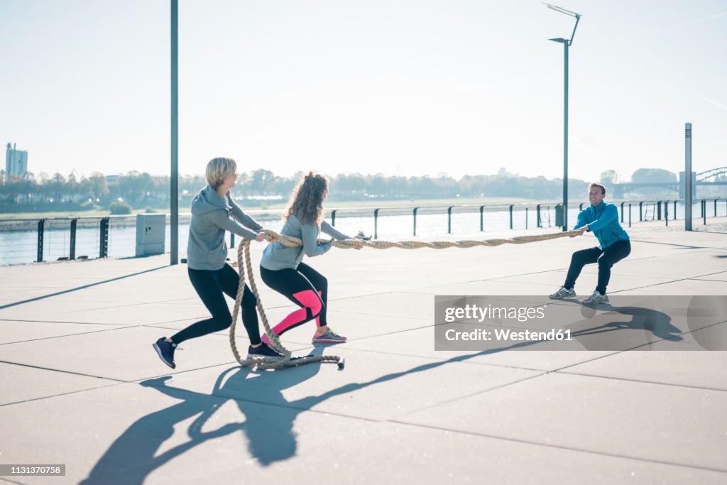 Friends Rope Pull Friends Training At The Riverside Pulling Rope High-Res Stock Photo ...