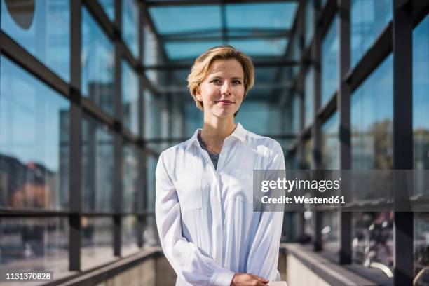 portrait of a young businessoman in the city - facing camera professional outdoor stock pictures, royalty-free photos & images