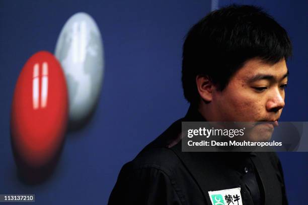 Ding Junhui of China looks to play a shot in the round two game against Stuart Bingham on day nine of the Betfred.com World Snooker Championship at...