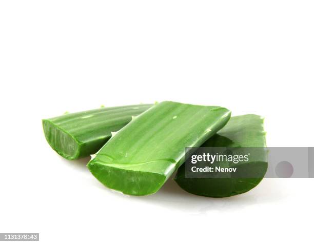 close-up of aloe vera slice on white background - aloe stock pictures, royalty-free photos & images
