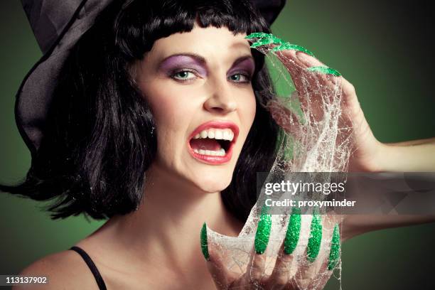 halloween woman face witch with her green nails - witch costume stock pictures, royalty-free photos & images