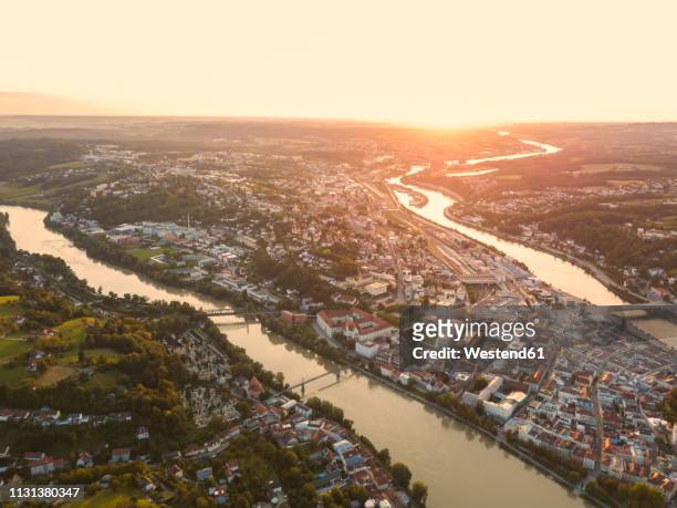 germany, bavaria, passau, city of three rivers, aerial view, danube and inn river, veste oberhaus and maria hilf at sunset - inn stockfoto's en -beelden