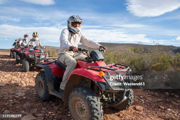 group of people quad biking in south africa - quad foto e immagini stock