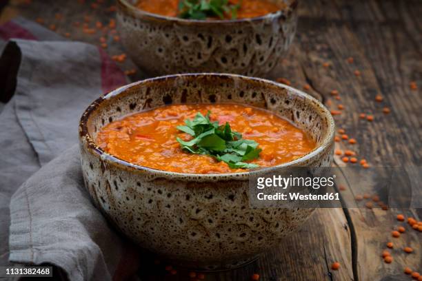 red lentil soup with paprika, ginger and coconut milk and coriander - lentil soup stock pictures, royalty-free photos & images