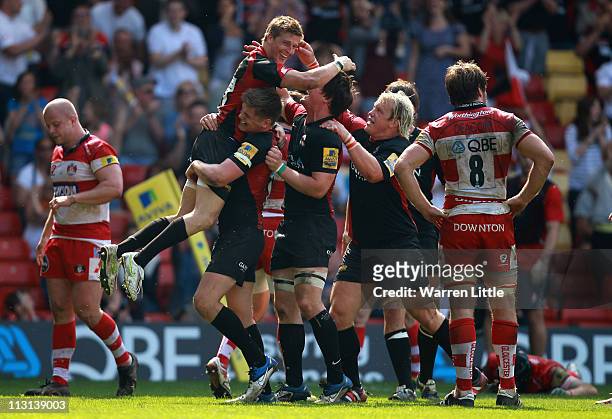 David Strettle of Saracens is congratulated by his team mates after scoring the fourth bonus try during the Aviva Premiership match between Saracens...