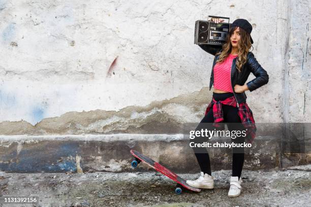 beautiful young woman with boom box - ghetto blaster stock pictures, royalty-free photos & images