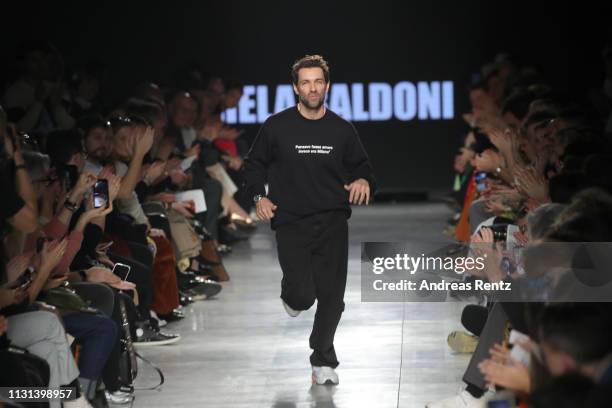 Designer Massimo Giorgetti acknowledges the applause of the audience at the MSGM show at Milan Fashion Week Autumn/Winter 2019/20 on February 22,...