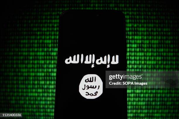 In this photo illustration, the Islamic State flag is seen displayed on an Android mobile phone.