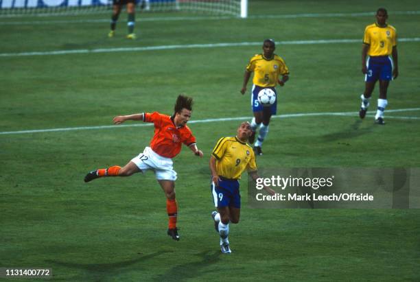 July 1998 - FIFA World Cup - Semi Final - Stade Velodrome - Brazil v Netherlands - Boudewijn Zenden of the Netherlands heads the ball away from...