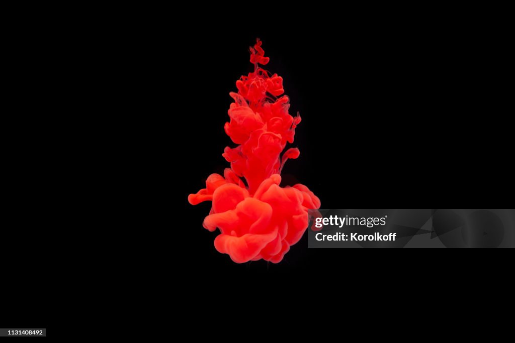 Ink in water. Abstract background. . Ink swirling in water. Ink in water isolated on black background. Colorful ink in water.