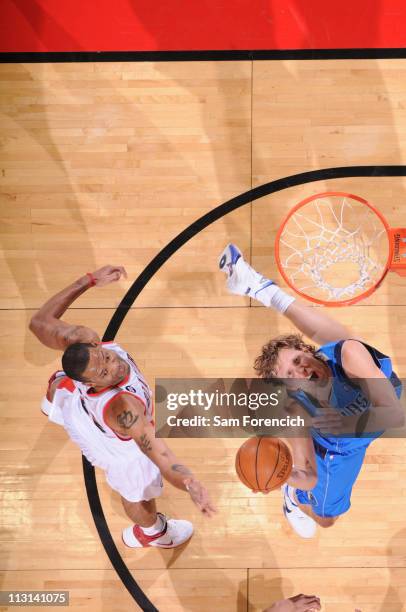 Dirk Nowitzki of the Dallas Mavericks shoots against Marcus Camby of the Portland Trail Blazers in Game Four of the Western Conference Quarterfinals...